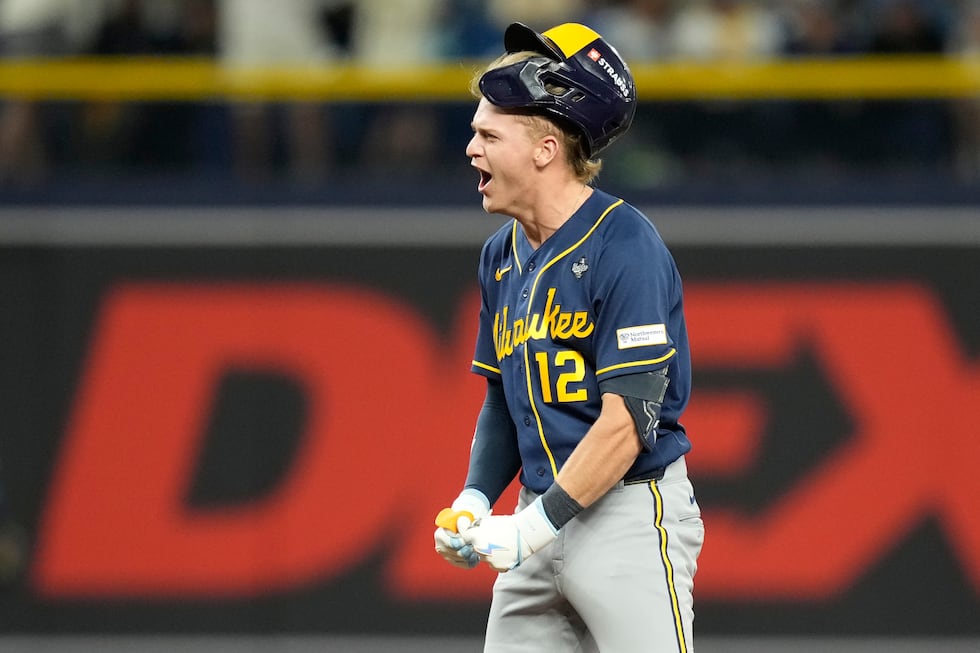 Milwaukee Brewers' Cooper Pratt celebrates his RBI-double during the fourth inning of Game 4...