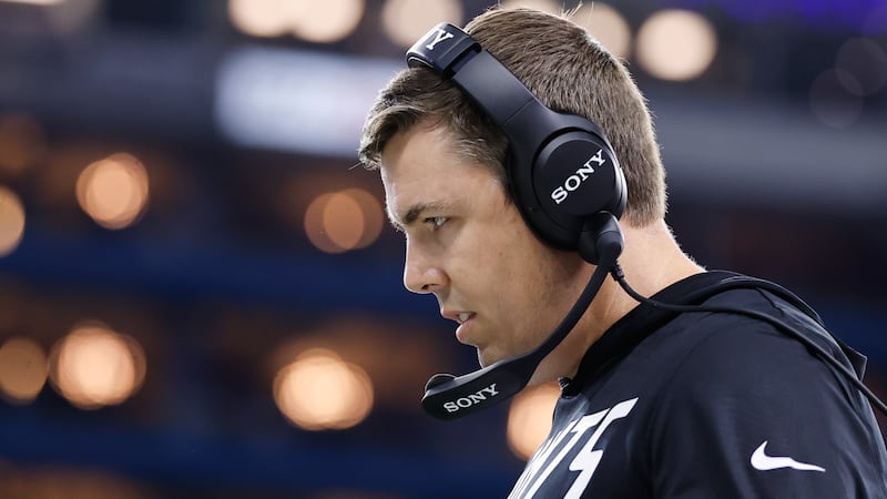 Saints coach Kellen Moore walks on the sideline in the first half of New Orleans' 31-30 loss...