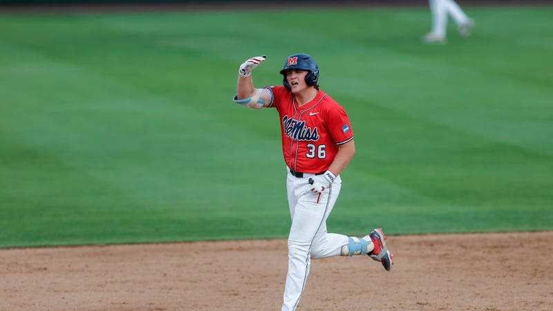 Ole Miss's Will Furniss (36) celebrates a home run during an NCAA super regional baseball game...